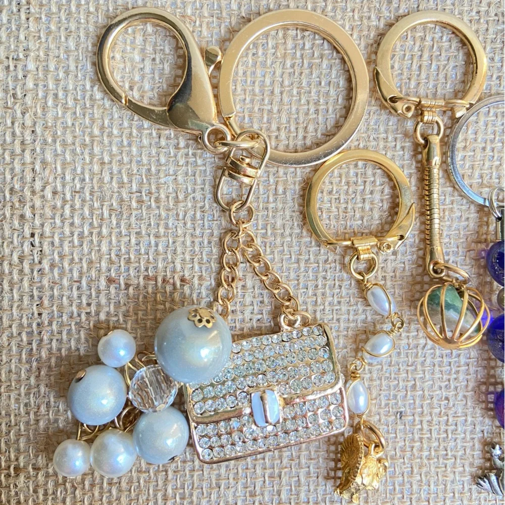 Lot of key chains rings with faux pearls bag airplane teacher in mixed tones